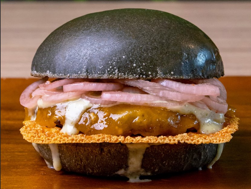 Our "Redemption Burger" elevates the classic cheeseburger with a tangy mayo made from homemade pickles using local cucumbers brined in vinegar, salt, sugar, and cili padi. This bright and flavorful sauce, combined with pickled red onions brined with Asam Boi, offers a unique twist found nowhere else.